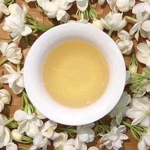 cup of pale gold Dragon Buds Jasmine tea